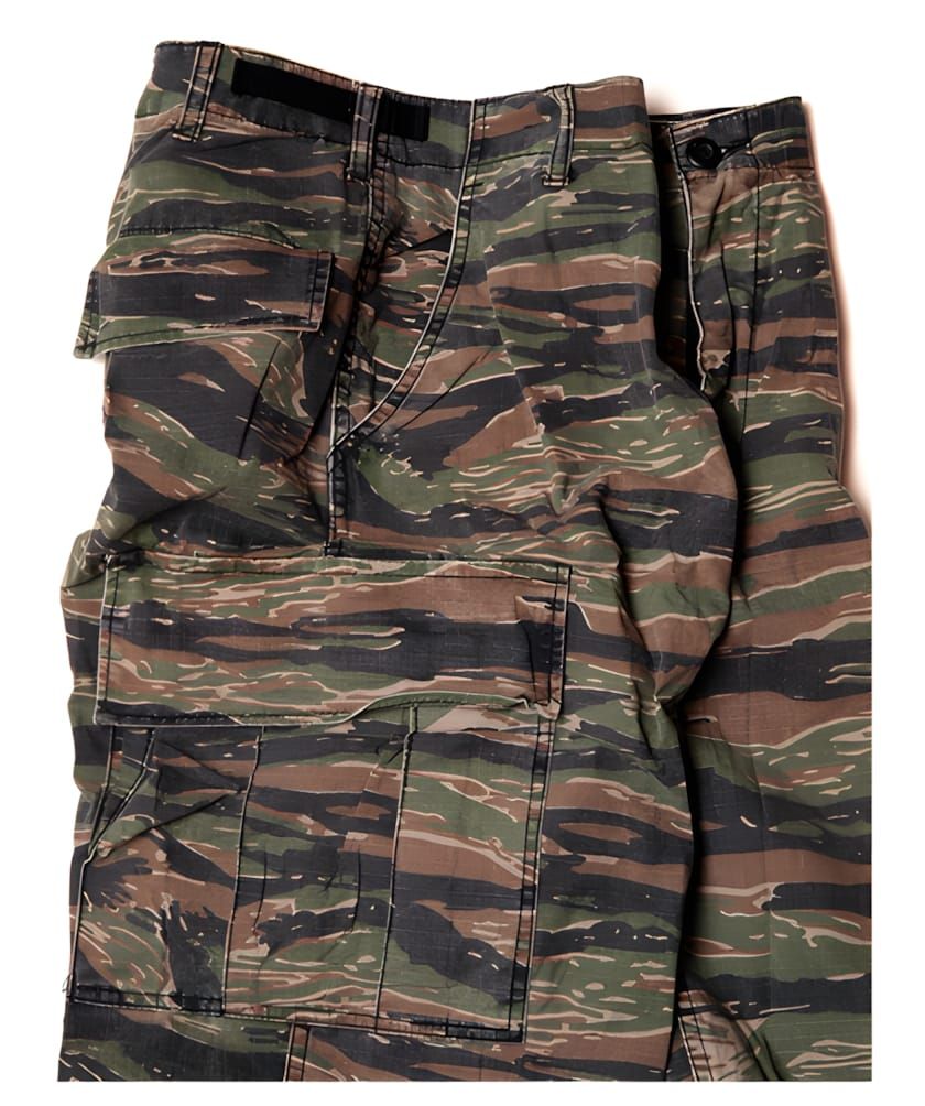 Flat-lay product shot of Rothco tiger stripe camouflage fatigue trousers, showing the six-pocket cut with slash side pockets 