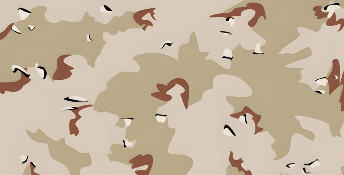 Close-up of US 6-Color Desert 'Chocolate Chip' camouflage textile: tan/sand base with rounded chocolate-brown blobs and small