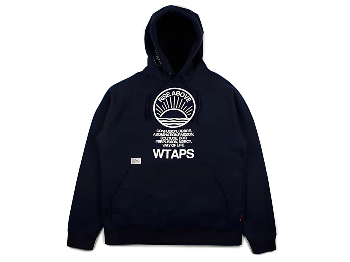 WTAPS navy cotton pullover hoodie laid flat, showing a circular embroidered crest with a sunrise graphic and 'RISE ABOVE' arc