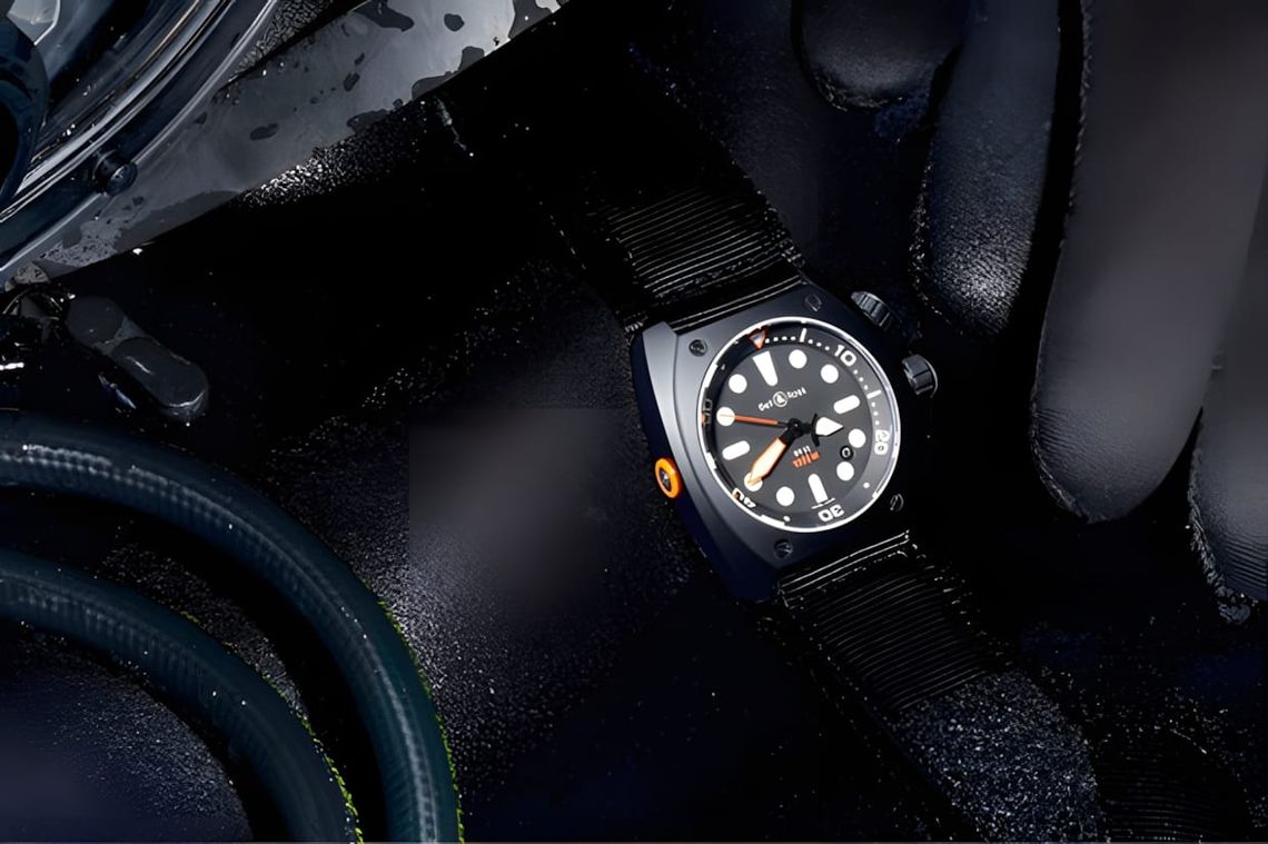 Bell & Ross BR 02-92 Steel Pro Dial Marine on a black canvas NATO strap, photographed on a diver's neoprene glove with hoses 