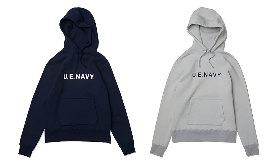 Two uniform experiment U.E. Navy pullover hoodies on a white background — navy (left) and grey (right) — each with 'U.E.NAVY'