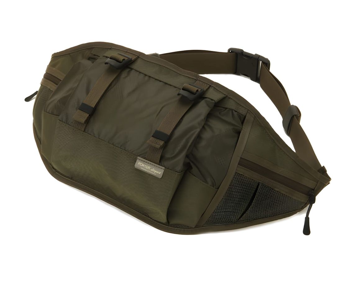 Porter Liquid Waist Bag in olive khaki nylon, white background product shot, large hip pack with diagonal front zip.