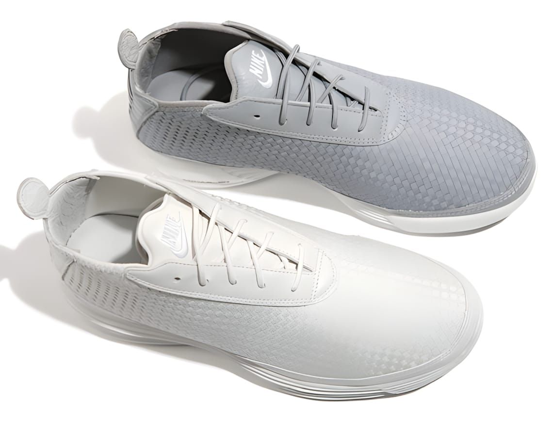Nike Air Footscape Woven sneakers overhead view, cool grey and off-white colorways, woven upper.