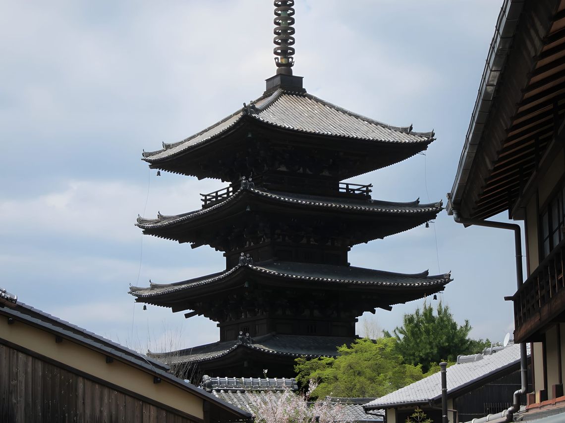 Five-story Yasaka Pagoda (Hokan-ji Temple) rising above a narrow stone-paved street in the Gion Higashiyama district of Kyoto