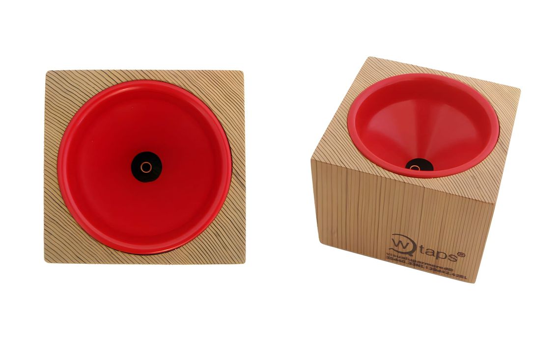 Two views of the WTAPS x M&M Incense Chamber: a top-down view of the square wood base with red ceramic bowl insert and centra