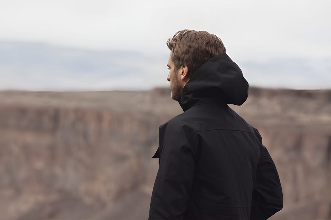 Model wearing a technical outerwear jacket from the Aether Apparel Fall/Winter 2012 lookbook, featuring a performance shell w