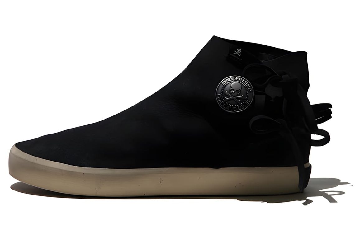 Mastermind Japan x Visvim Gila Moc Mid-Top in black suede with skull coin medallion and heel tassel, gum sole, Fall 2011.