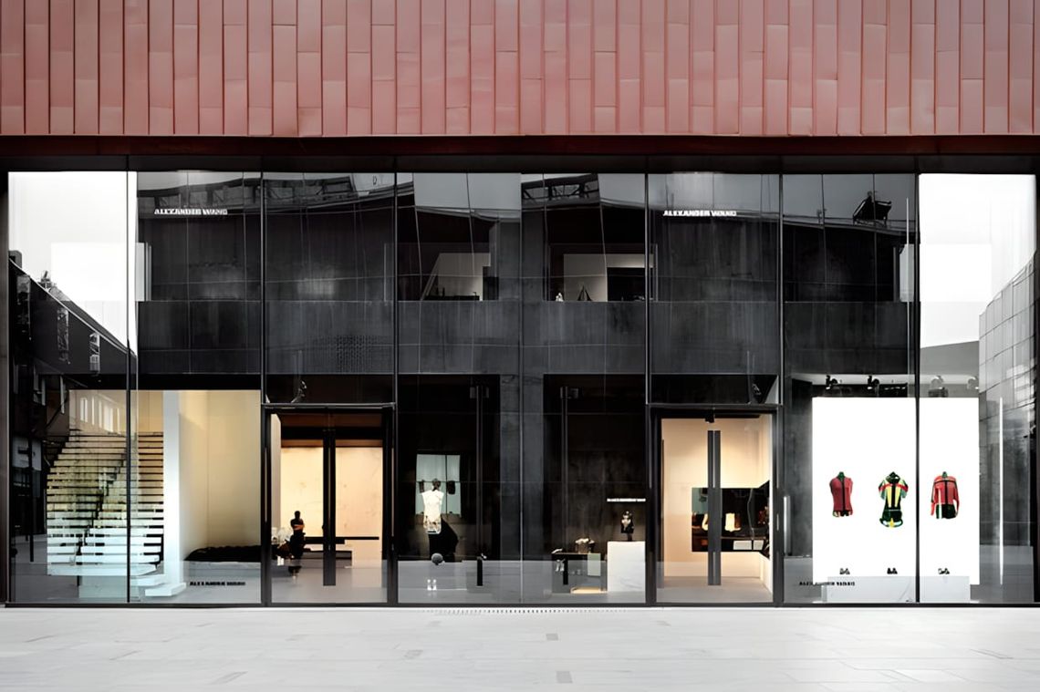 Interior of the Alexander Wang Beijing flagship store at Sanlitun Village, 2012, featuring raw concrete walls and industrial 