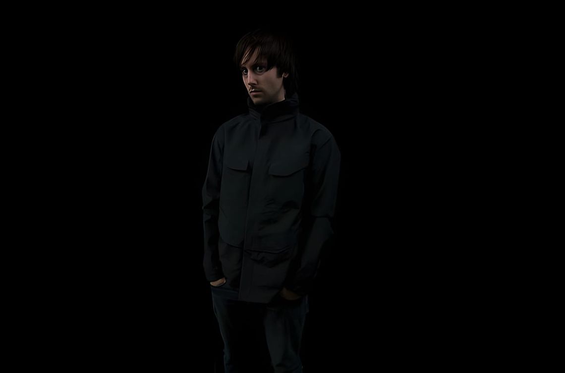 Arc'teryx Veilance Field Jacket in black, four-pocket technical nylon shell, front view against neutral background.