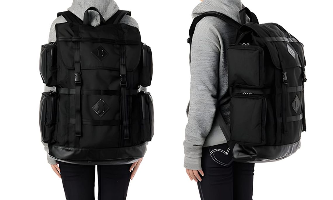 Burton Fathom 44L pack in all-black twill, front and back views worn by a female model.