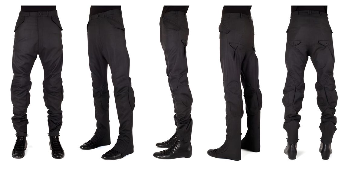 Aitor Throup trouser displayed alongside its deconstructed pattern pieces, showing the complex panelling and dart constructio