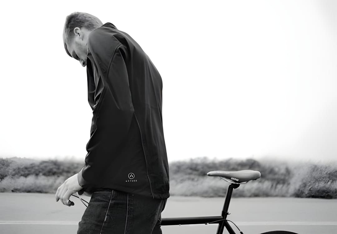 Black technical jacket from Aether Apparel, shown in a product or editorial context, featuring a streamlined outerwear silhou