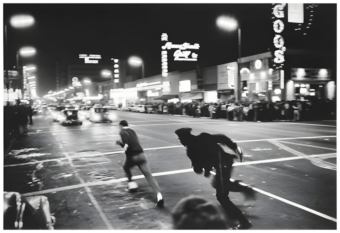 LAPD officers conducting an arrest on Hollywood Boulevard, photographed by Julian Wasser in 1970.