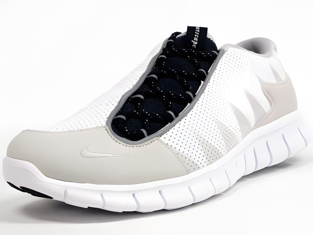 Nike Footscape Free sneaker in white perforated leather upper with light grey suede overlays on toe cap and heel, black bunge
