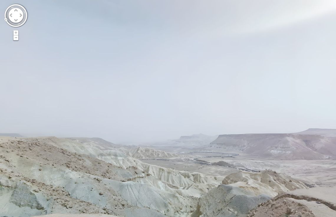 Google Street View panorama from a ridge above the Zin Valley in the Negev Desert, Israel, showing bleached chalk badlands in