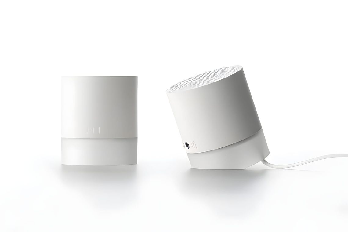 11+ Sound1 cylindrical Bluetooth speaker by Cloudandco — paired matte white speakers with angled bases designed to tilt for o