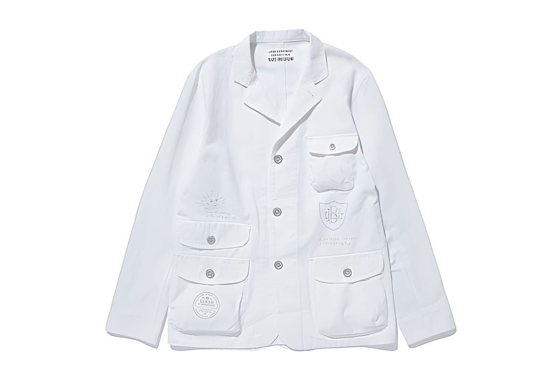 Luker by Neighborhood white field jacket, size medium, four front pockets, embroidered crest and badge patches on chest.