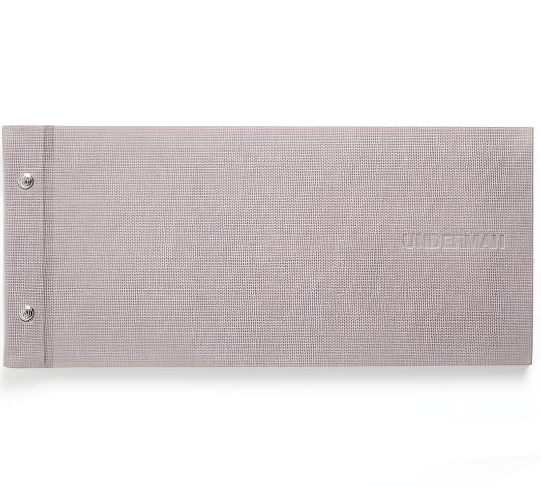 Undercover SS2011 Underman cardbook: grey linen-textured landscape binder with debossed UNDERMAN text and two silver screw po