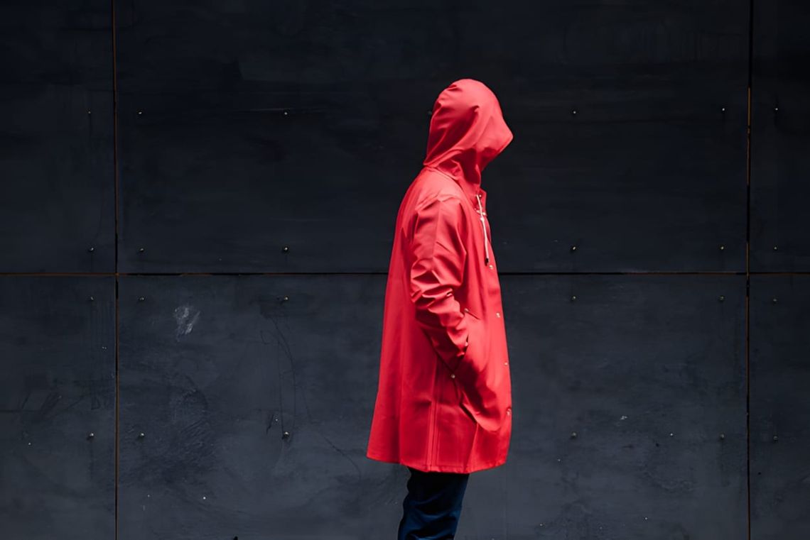 Stutterheim Stockholm raincoat in red, full-length product view