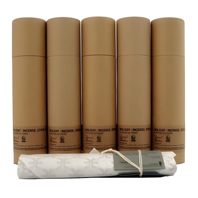 Five kraft cardboard cylindrical tubes labeled 'Leia / Incense' by Kuumba International, arranged in a row, with a wrapped bu