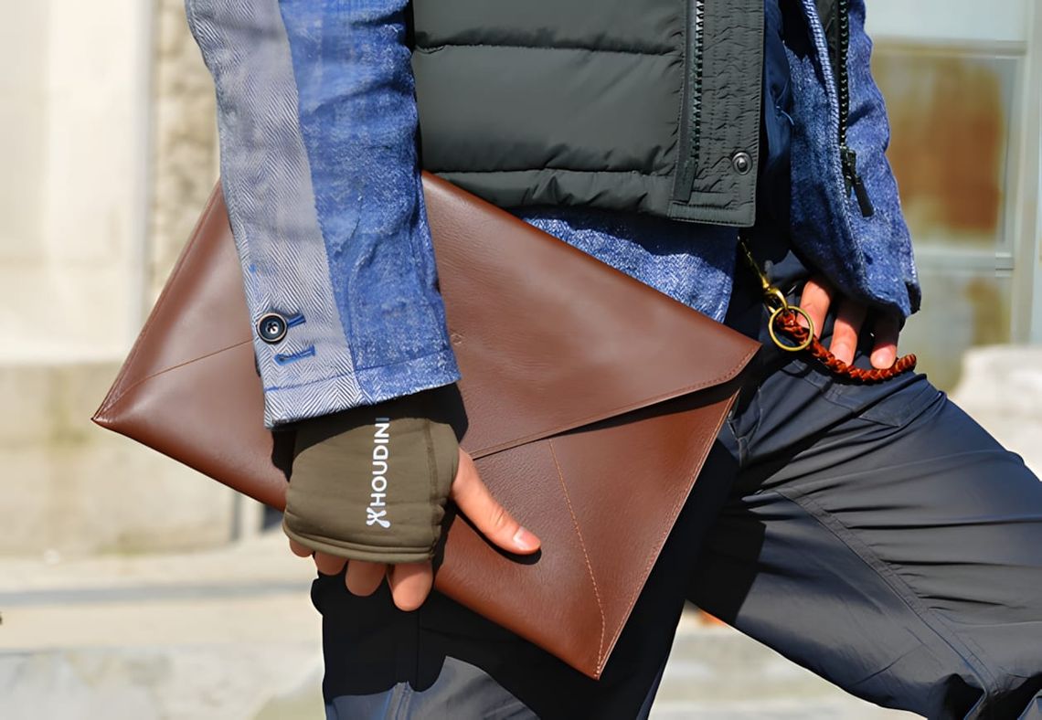 Vegetable-tanned leather envelope document case with folded flap closure, shown flat