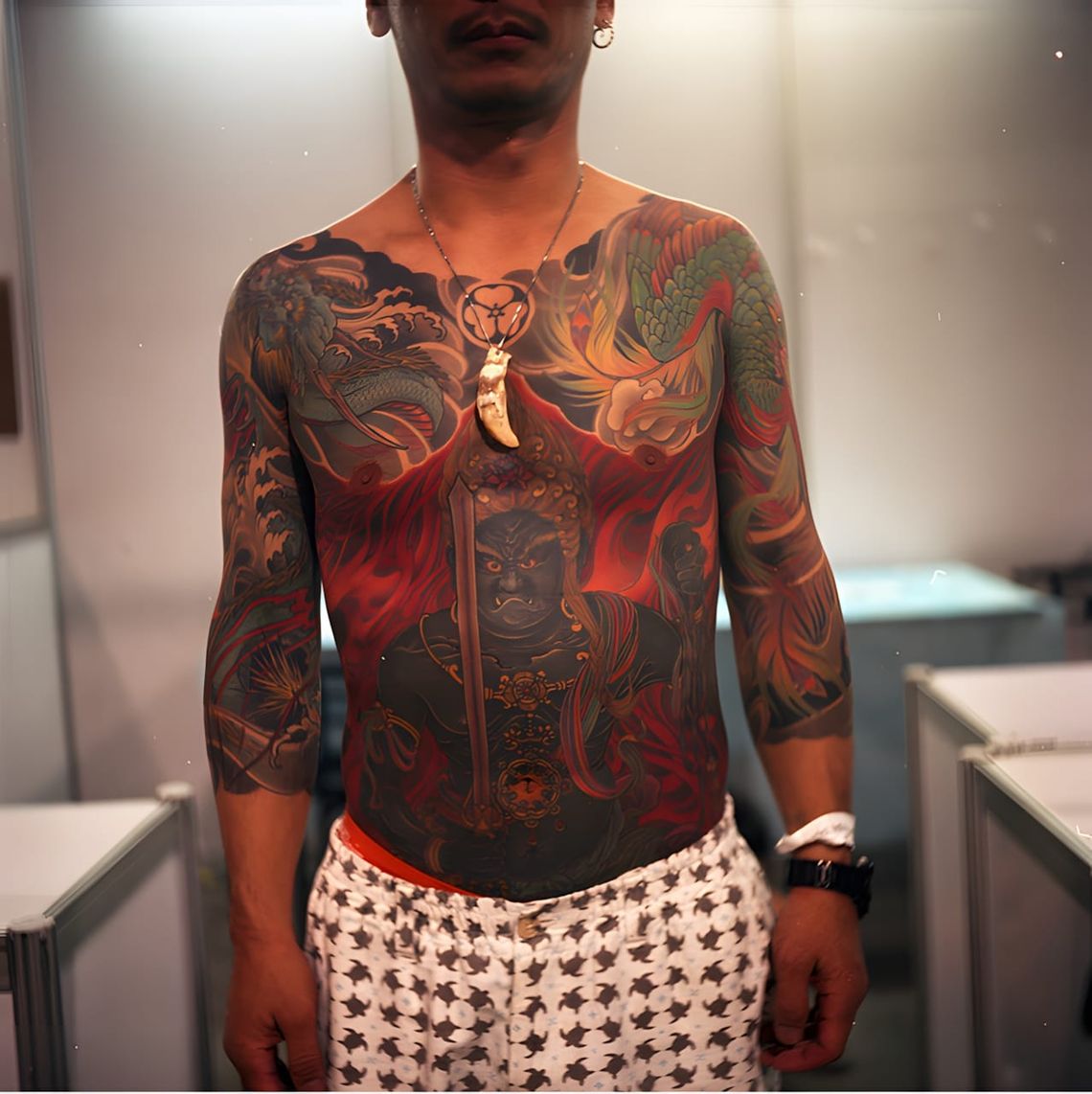 Irezumi tattoo of Fudo Myoo (Acala) on a man's chest and torso, traditional Japanese style, attributed to Shige at Yellow Bla