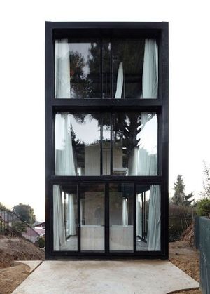 Earthquake-proof house on a hillside in western Chile by architects Pezo von Ellrichshausen