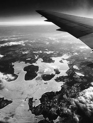 Aerial View from Airplane Window over Snow-Covered Archipelago