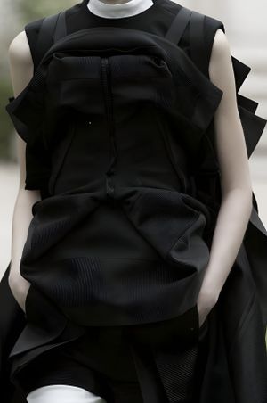 Junya Watanabe Runway Look — Dark Structural Silhouette
