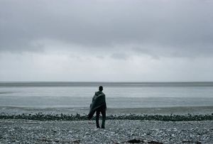Solitary Figure at Sea — Coastal Contemplation