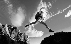 Figure Leaping on Mountain — Outdoor Adventure Photography