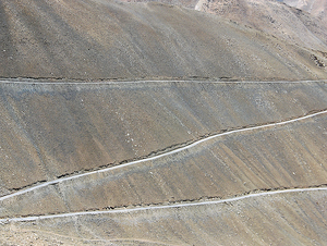 Switchback Roads across Barren Mountain Slopes