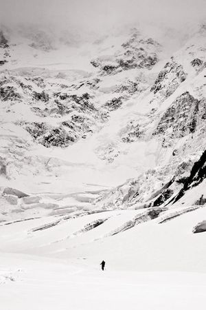 Out in the White — Lone Mountaineer on a Glacier