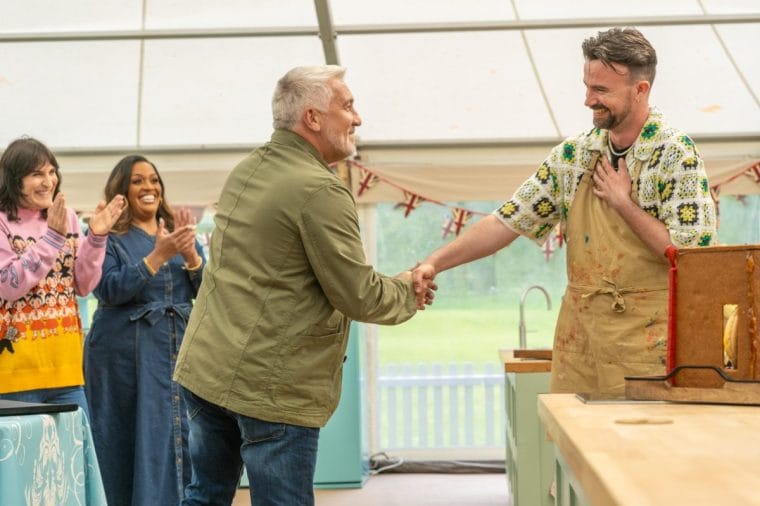 Paul giving out the coveted handshake on the Great British Baking Show