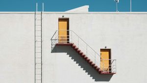 Stairways and shadows and doorways and ladders and sky