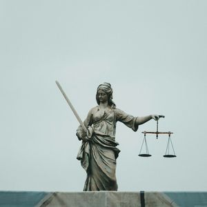 A statue representing the scales of justice.