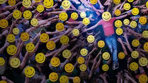 A kid where a Teen Mania shirt crowdsurfing. Everyone has a fake smile emoji on their face.