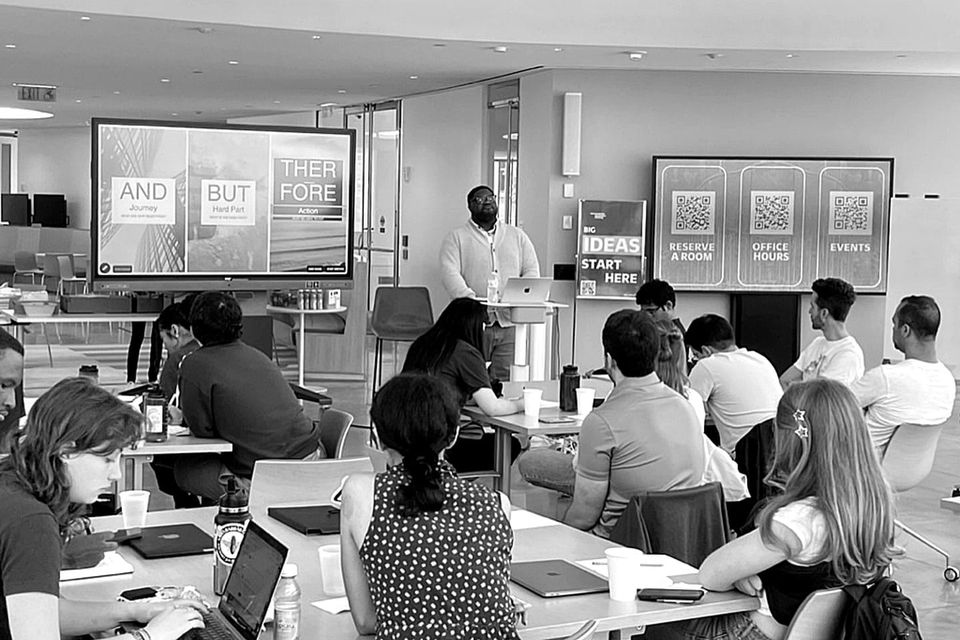 Adam Thomas teaching the And / But / Therefore narrative frame to a room of student founders