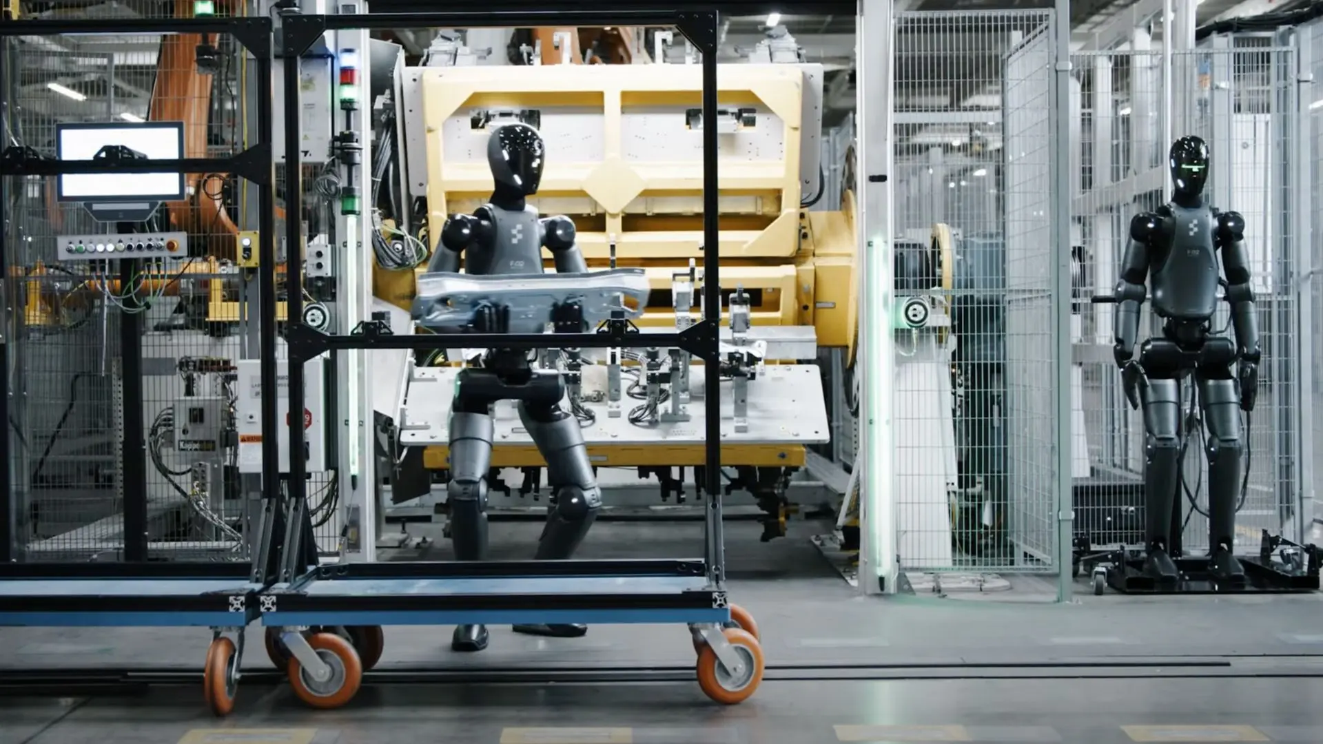 Figure humanoid robots working on a BMW assembly line.