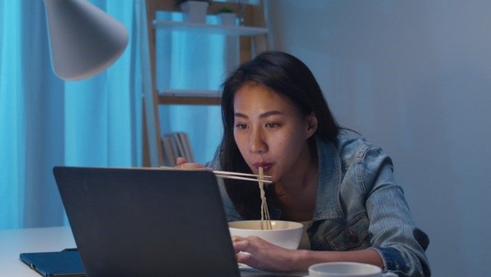 asian women eating ramen