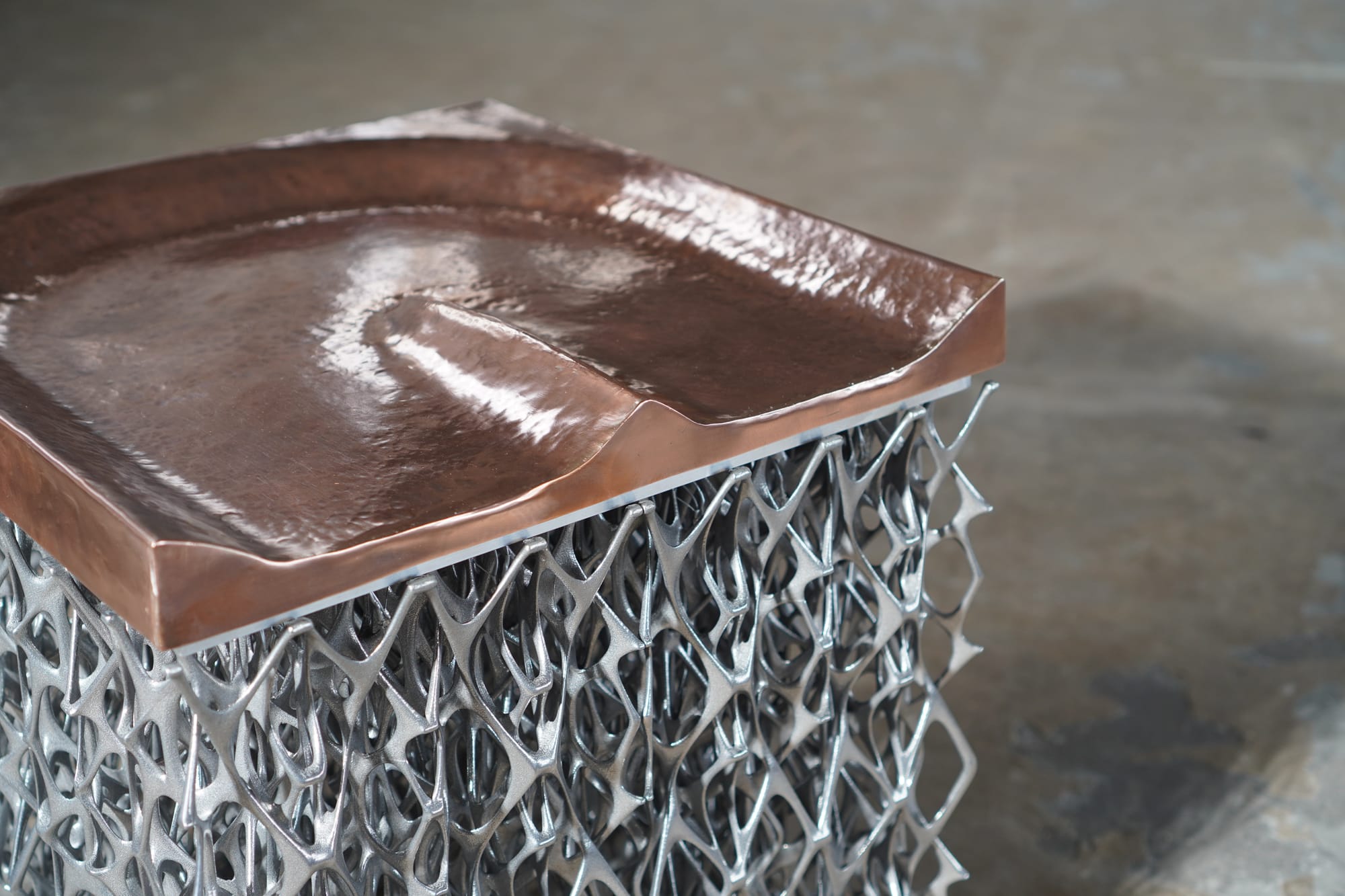 Peltchair by Lilian van Daal and Studio Synergy. Photography by Lilian van Daal and Studio Synergy. Close-off of biomimicry inspired 3D printed copper and aluminum seat.