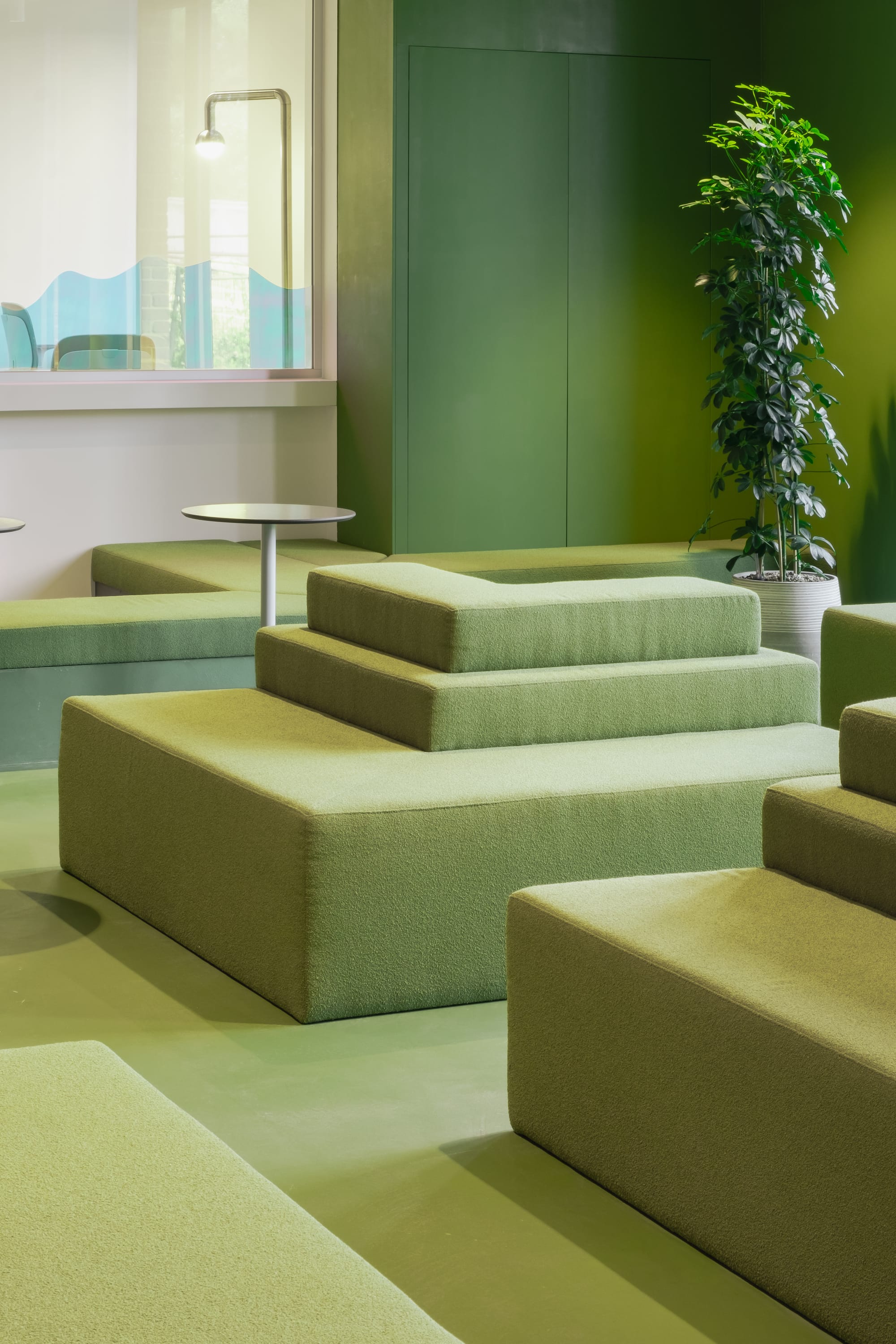 Silversquare Co-Working Space by Lilian van Daal. Photography by Safe as Studio. Green upholstery seating lounge office area.