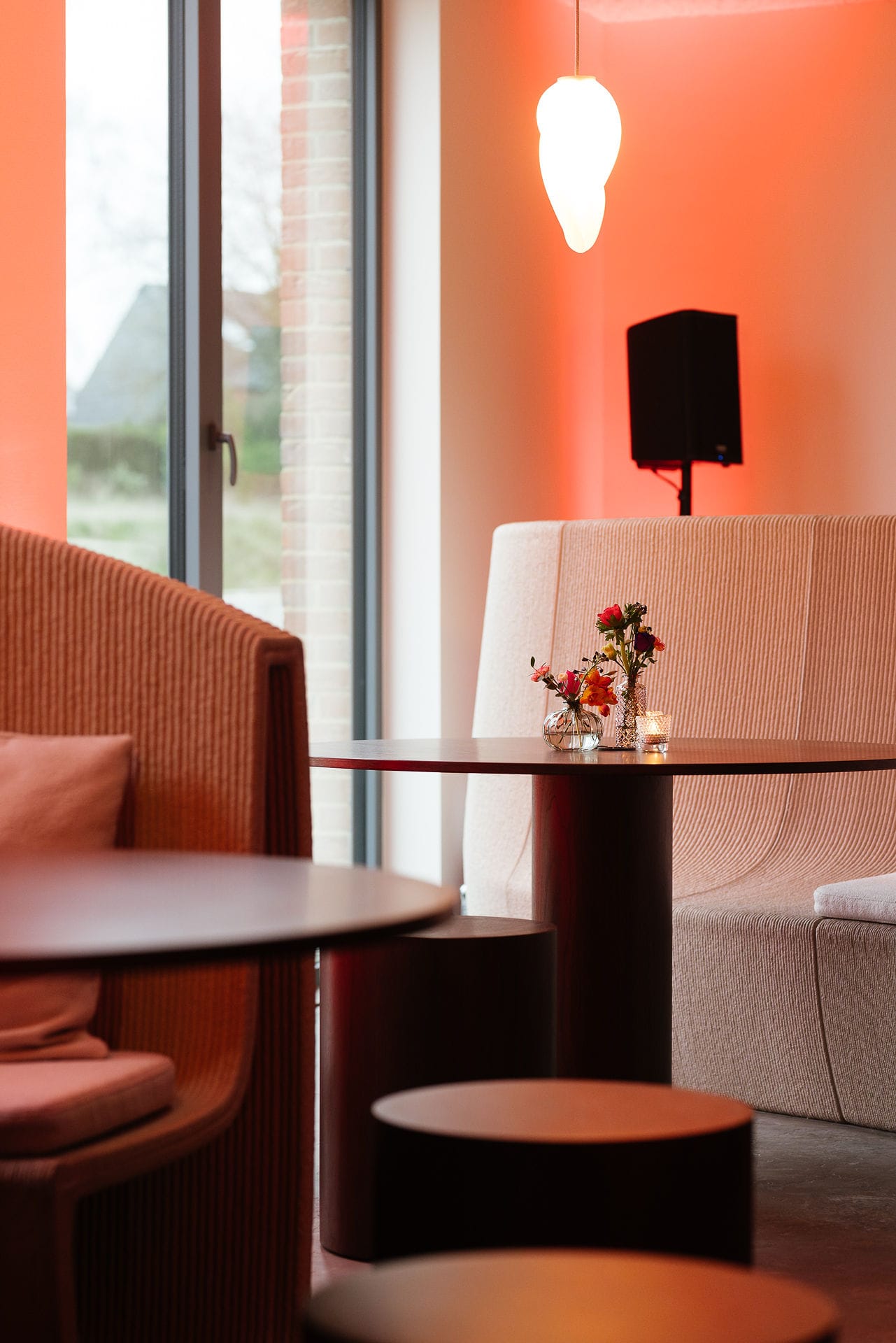 Silversquare Co-Working Space by Lilian van Daal. Photography by Safe as Studio. 3D printed fitted office furniture in beige and red hues.