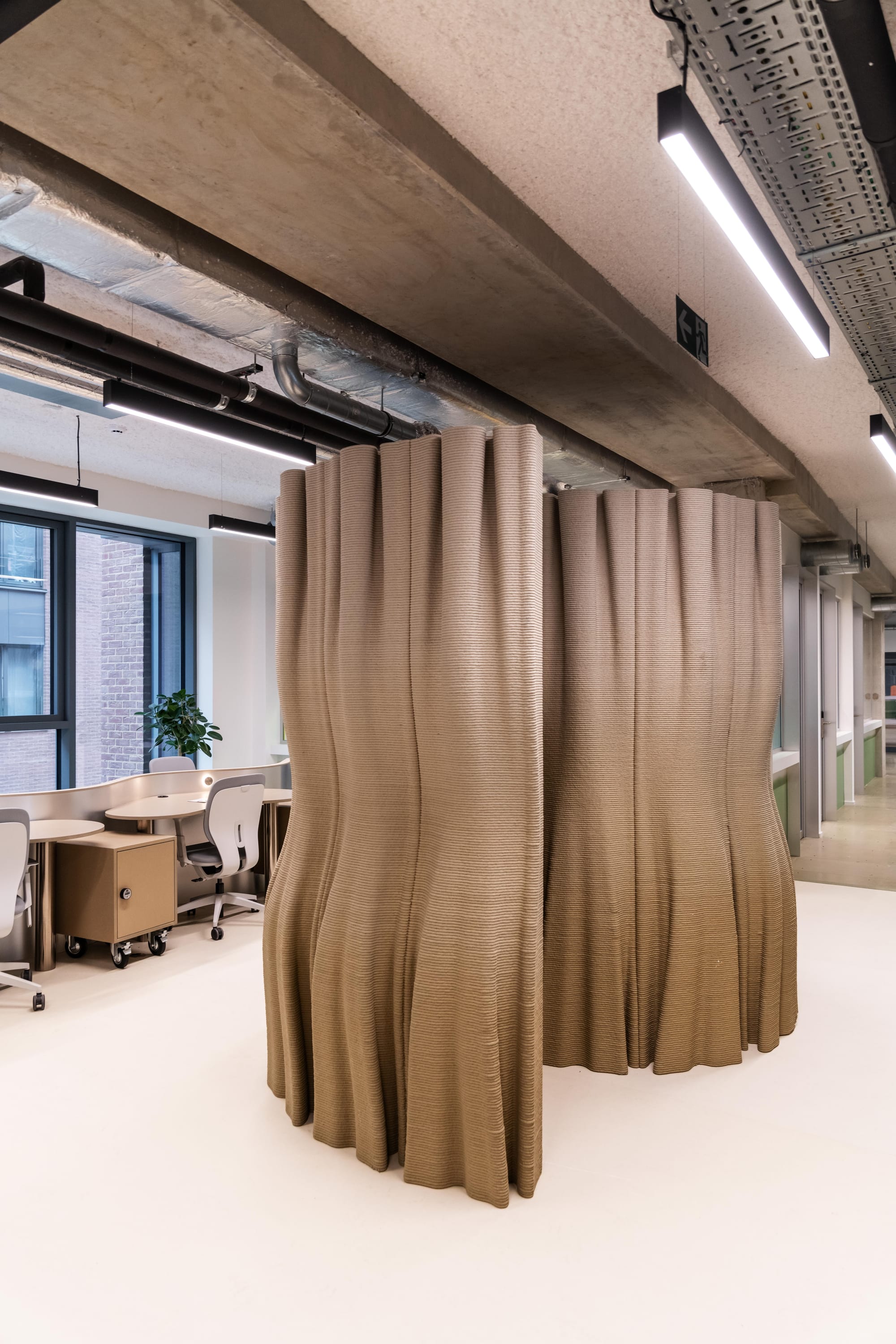 Silversquare Co-Working Space by Lilian van Daal. Photography by Safe as Studio. Sand colored, emerging technology printed partition.