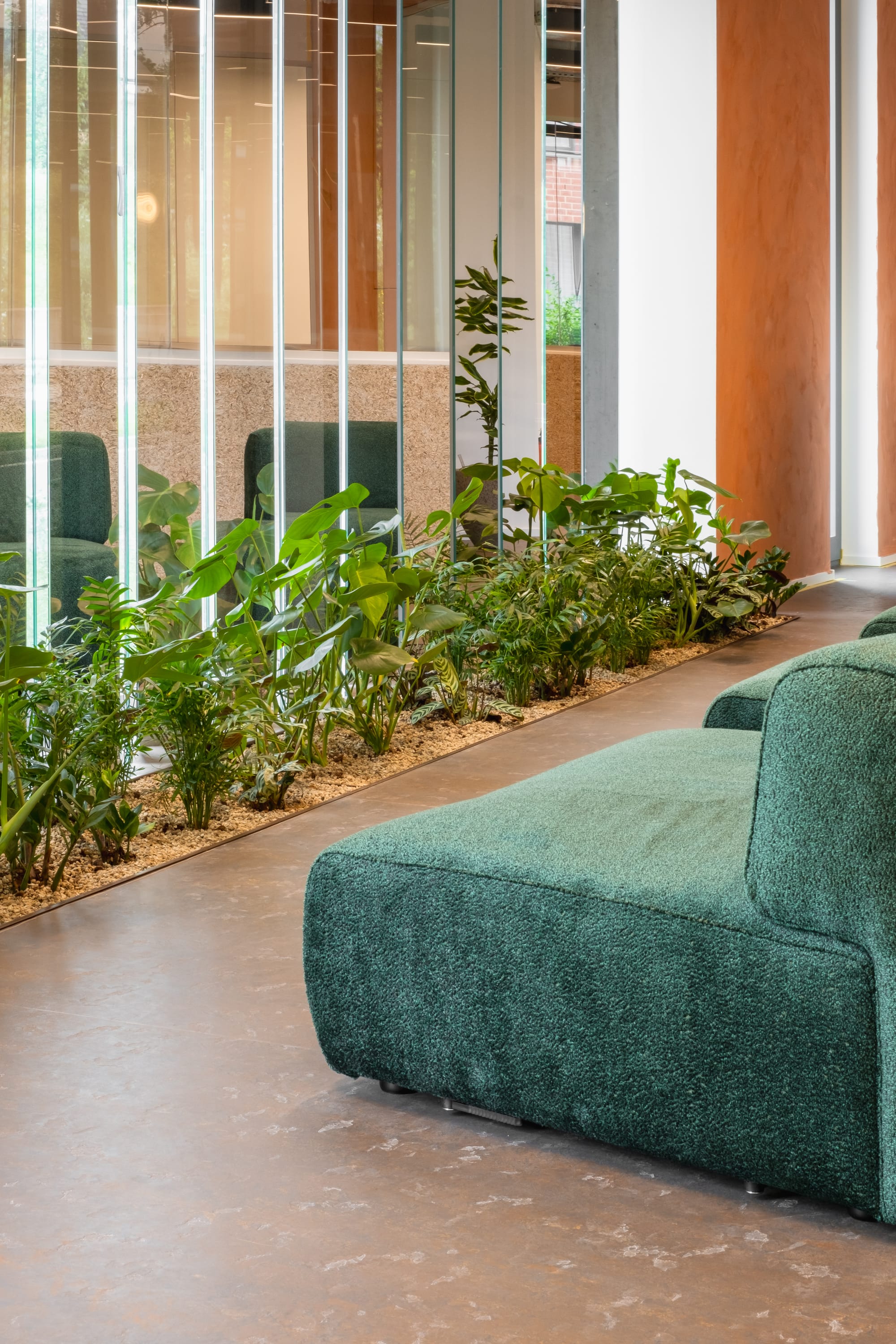 Silversquare Co-Working Space by Lilian van Daal. Photography by Safe as Studio. Biophilic design and green velvet couch.