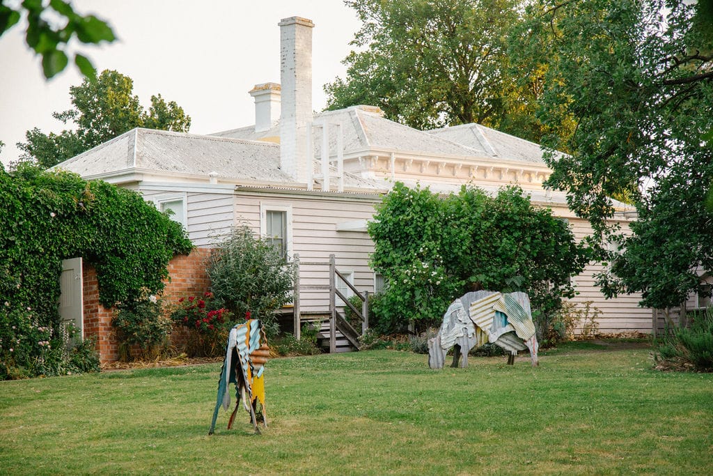 Heide Cottage. Photography by Clytie Meredith. French style cottage farmhouse with granden and cow sculptures.