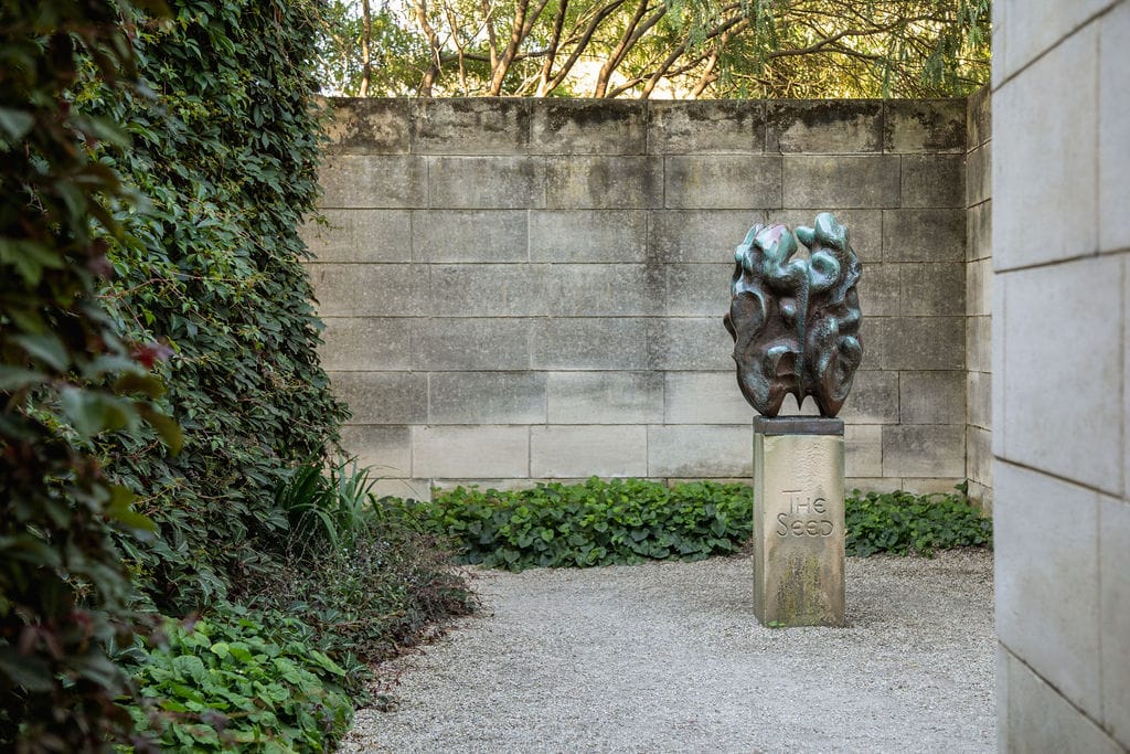 Heide Modern. Photography by Clytie Meredith. Walnut messing sculpture in from of limestone brick wall.