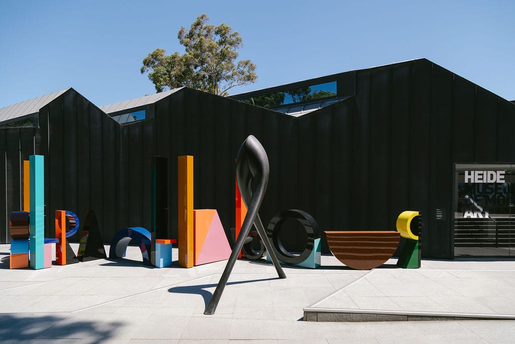Heide Main Galleries. Photography by Clytie Meredith. Modern black main art gallery with colorful art sculptures.
