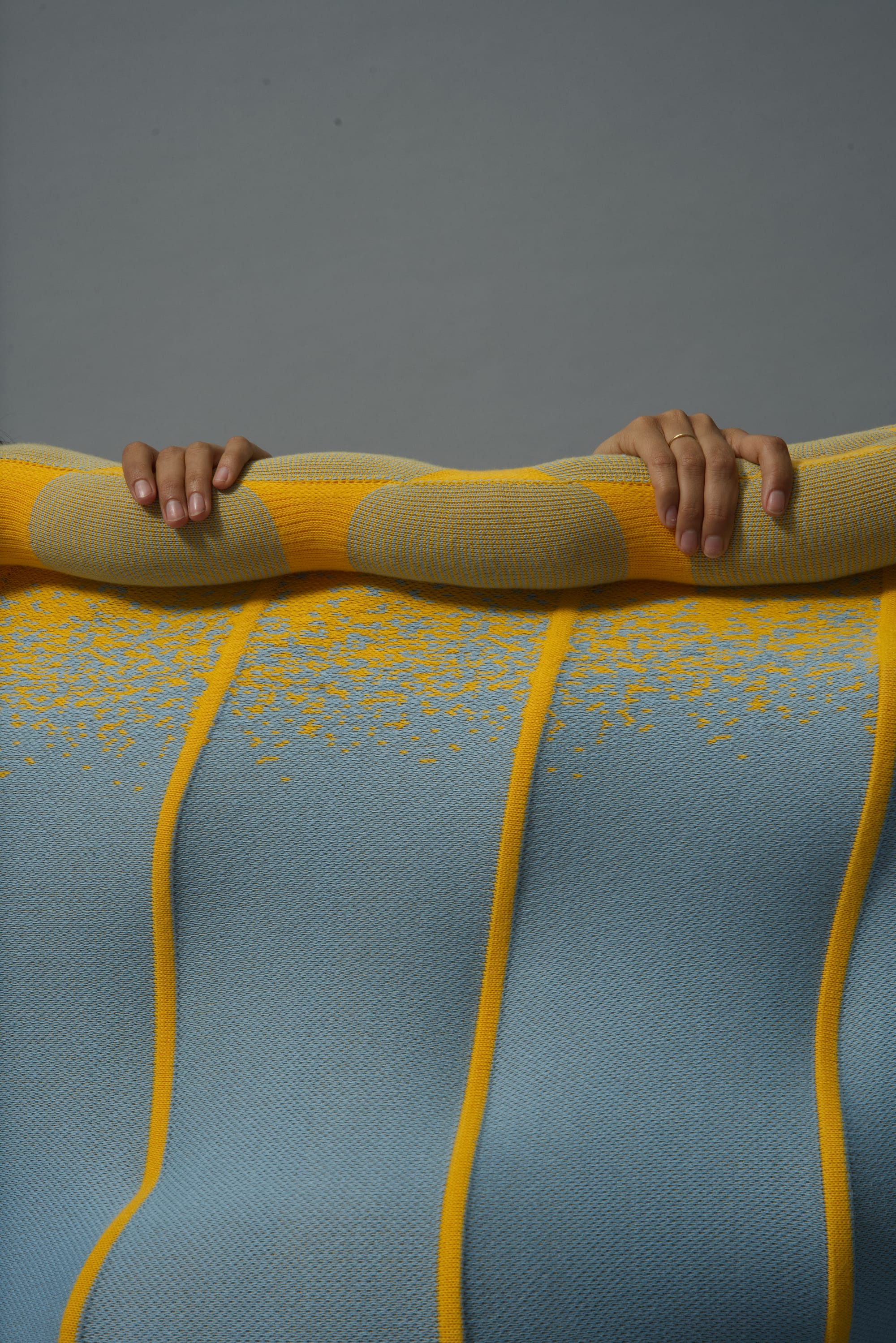 Tussuq by Luna Haverkorn. Photography by Kasper Heden Andersen. Blue and yellow knitted interactive furniture.