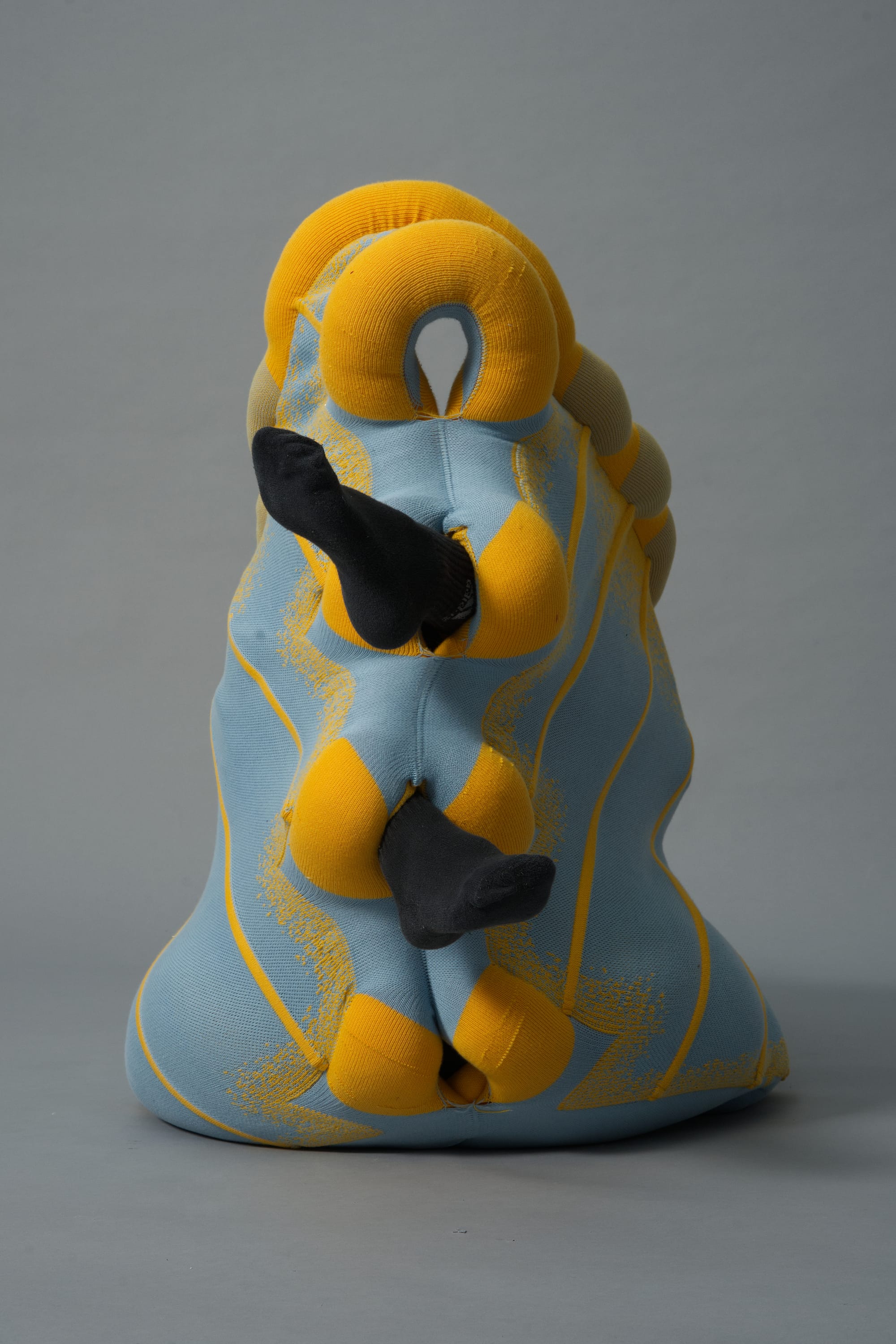 Tussuq by Luna Haverkorn. Photography by Luna Haverkorn. Yellow and blue knitted, interactive, innovative furniture design piece.